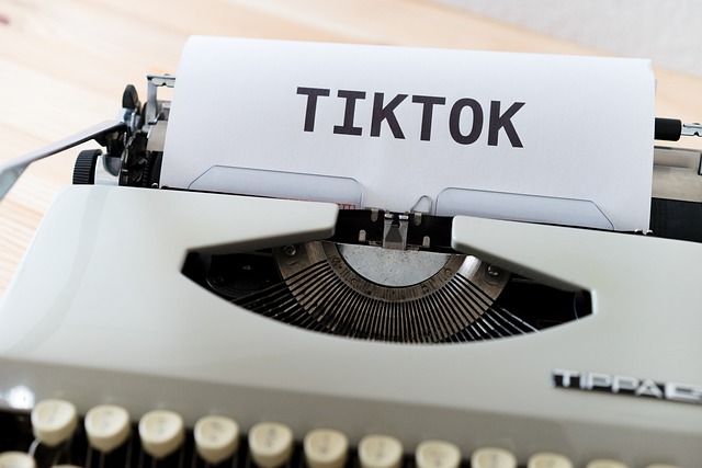 An antique printer prints the word "TikTok" on paper.
