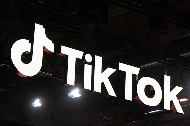 An overhead sign carrying the TikTok logo.
