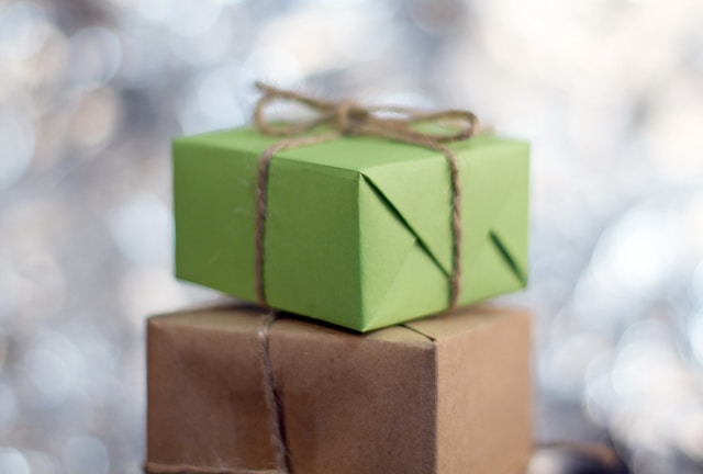 Presents wrapped in green and brown paper. 
