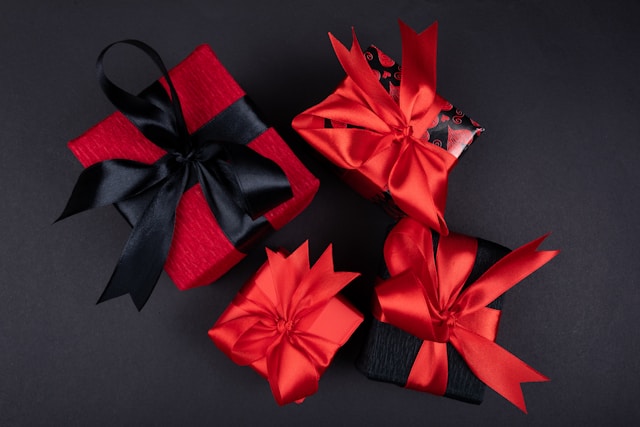 Red and black gift boxes with ribbons. 