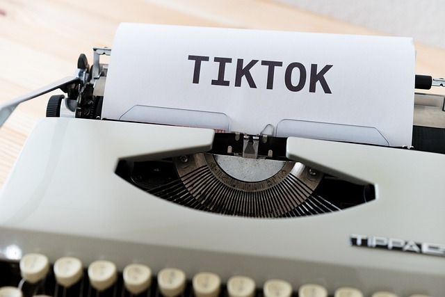 A typewriter prints out the word “TIKTOK.”
