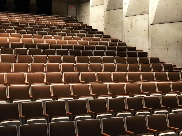 An auditorium with empty seats. 
