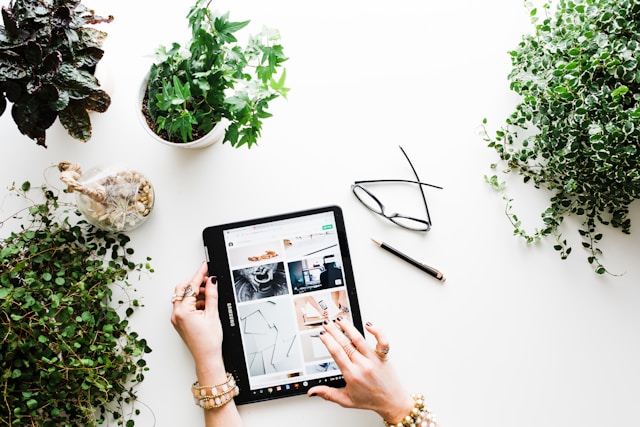 A woman browses products on her tablet. 
