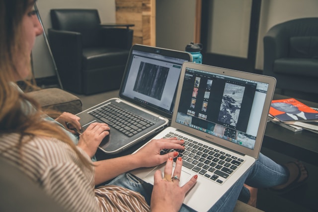 A woman edits a video on her laptop. 
