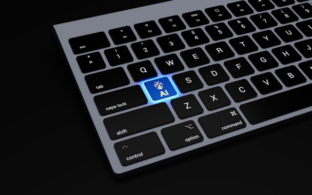 A computer keyboard features a back-lighted, blue AI key. 