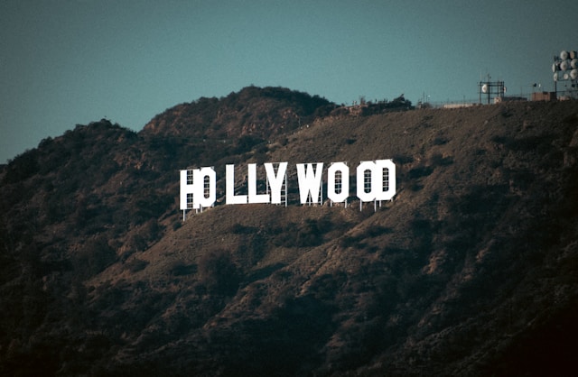 The white Hollywood sign on the side of a hill.