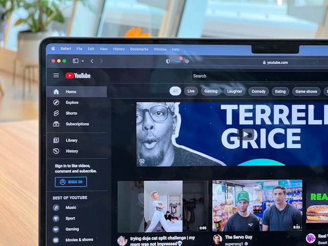 A Mac screen displays a YouTube creator’s Home page.
