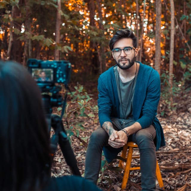 Someone records a man speaking to a camera.
