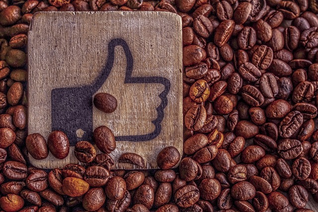 A wooden board with a like icon inside coffee beans.