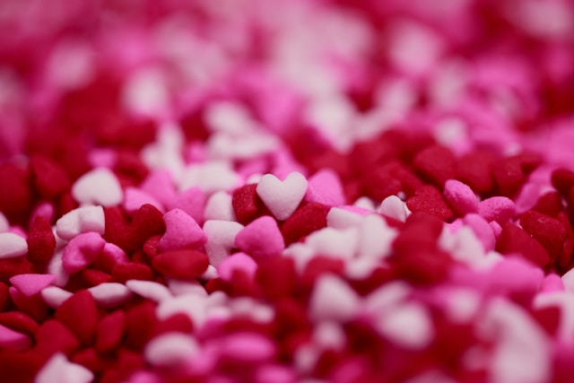 Tiny pink, red, and white confetti in the shape of hearts. 
