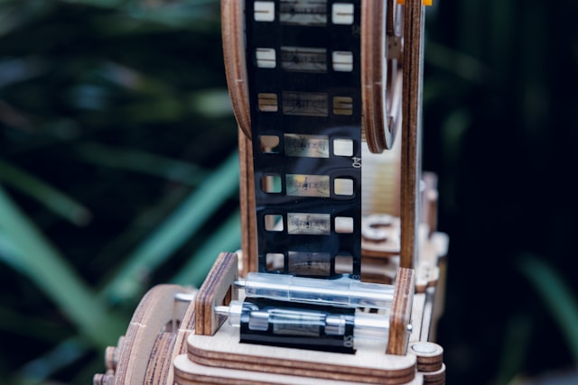 A traditional roll of film loaded onto a reel for editing.
