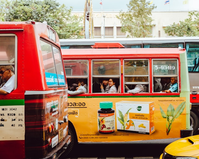 An advertisement for a health supplement printed on the side of a bus.