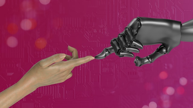 A human and a robotic hand touch each other.