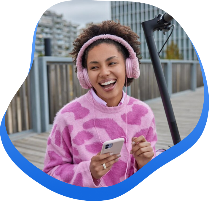 High Social's graphic with an Influencer wearing pink fuzzy headphones and sweater recording content for her TikTok feed.