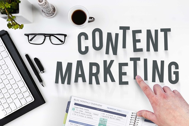 Someone points to a desk with the phrase “Content Marketing.”
