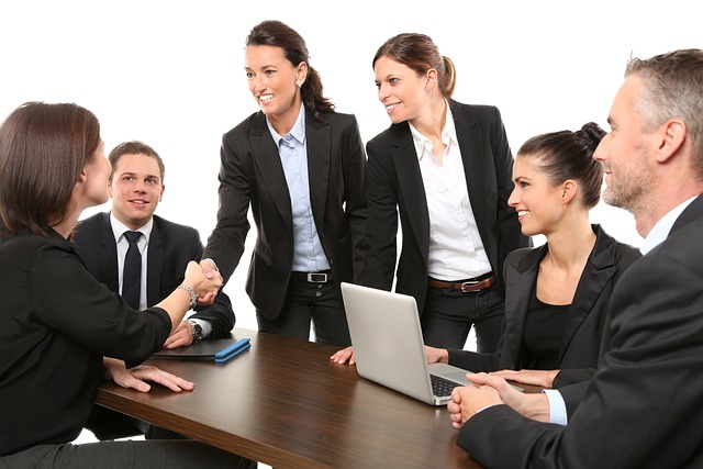 Several people in a business meeting.