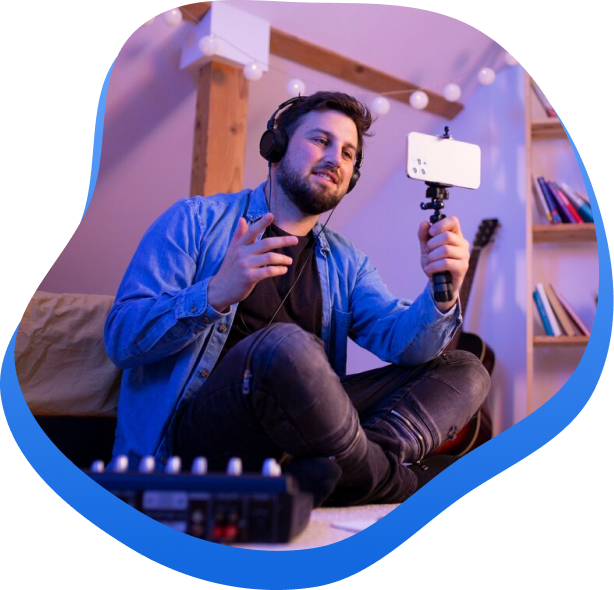 High Social's graphic showing a man recording a video on his smartphone while wearing headphones.