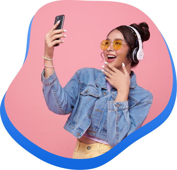 High Social's graphic of a TikTok influencer smiling and excited while looking at increased TikTok engagement on her smartphone.