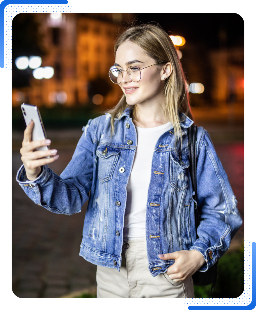 High Social's graphic showing a TikTok user with glasses using the TikTok app on a city street at night.